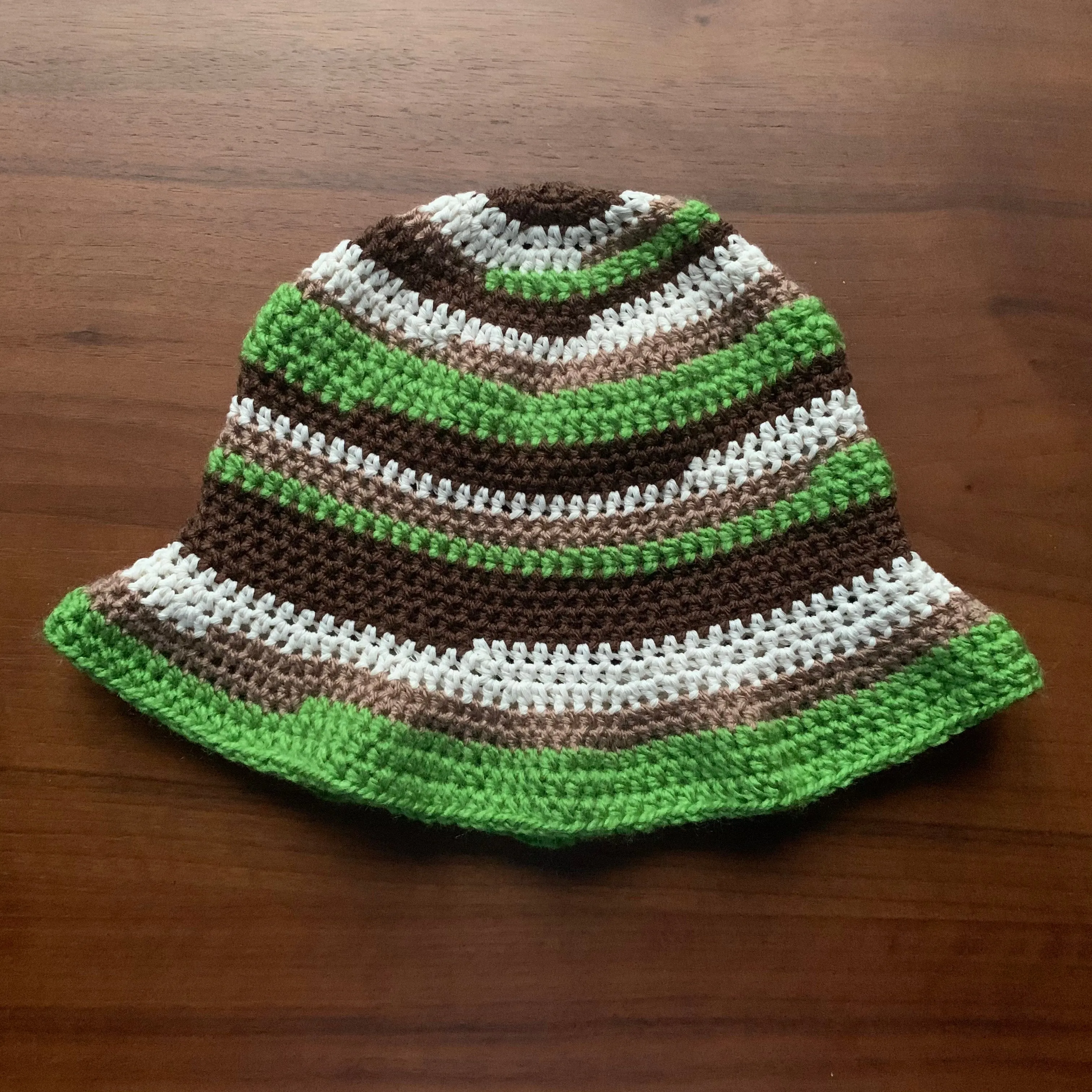 Handmade striped crochet bucket hat in green, brown and off white